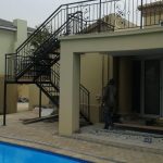 Structural Staircase with Iron Wrought Railing